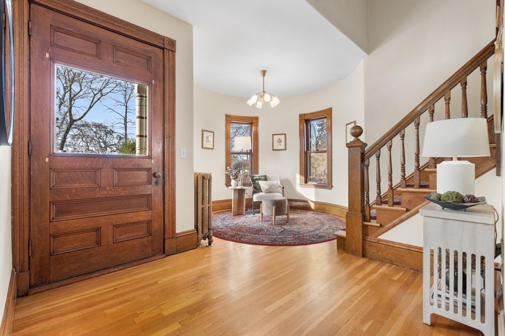 129 High Street Reading, MA 01867 - Photo 4 of 41 a view of living room kitchen and entryway