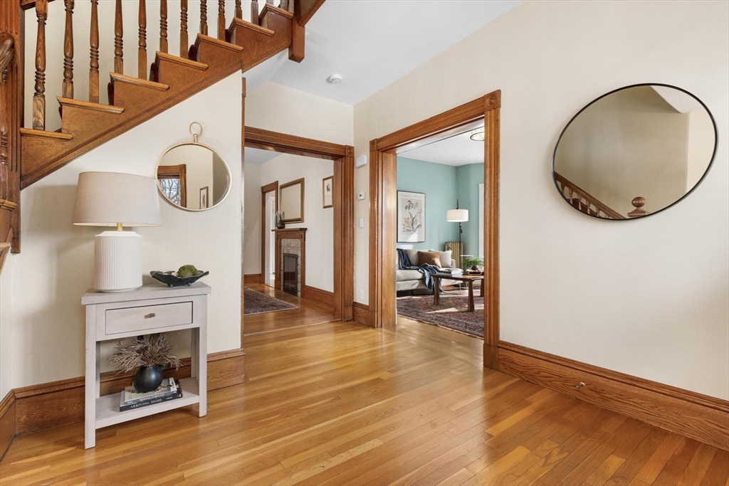 129 High Street Reading, MA 01867 - Photo 5 of 41 a view of livingroom and dining room with wooden floor