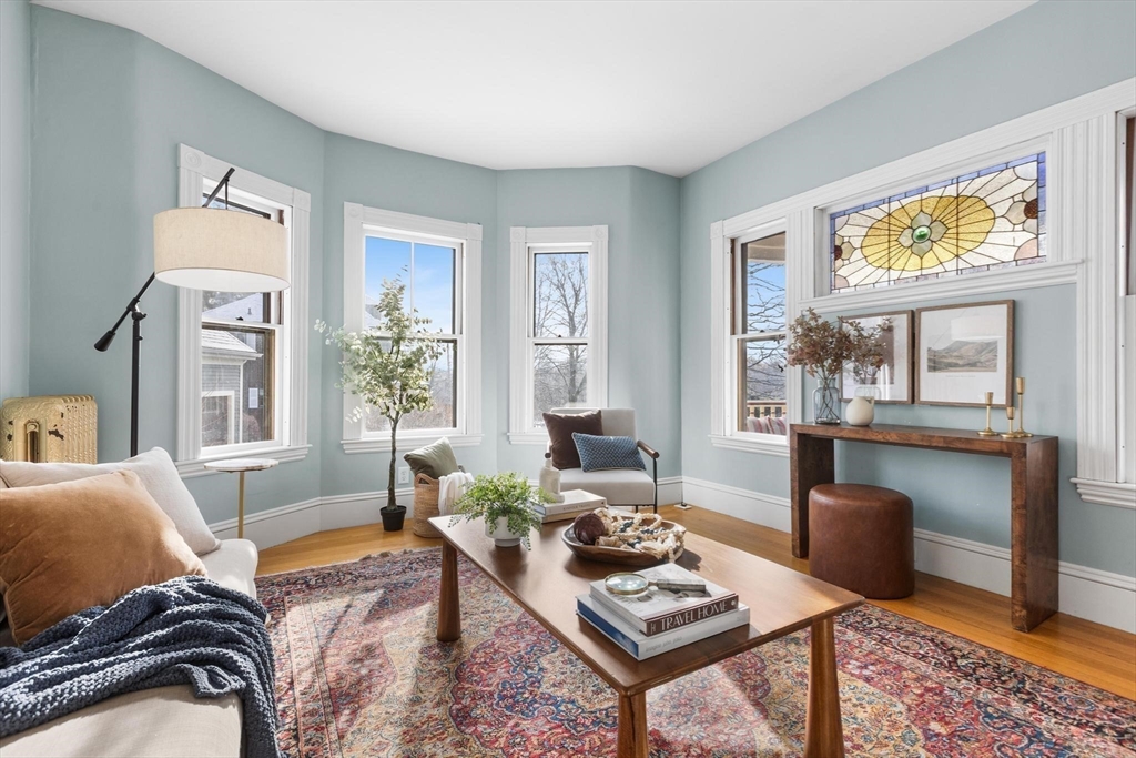 129 High Street Reading, MA 01867 - Photo 7 of 41 a living room with furniture and a window