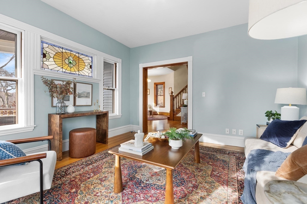 129 High Street Reading, MA 01867 - Photo 8 of 41 a living room with furniture rug and window
