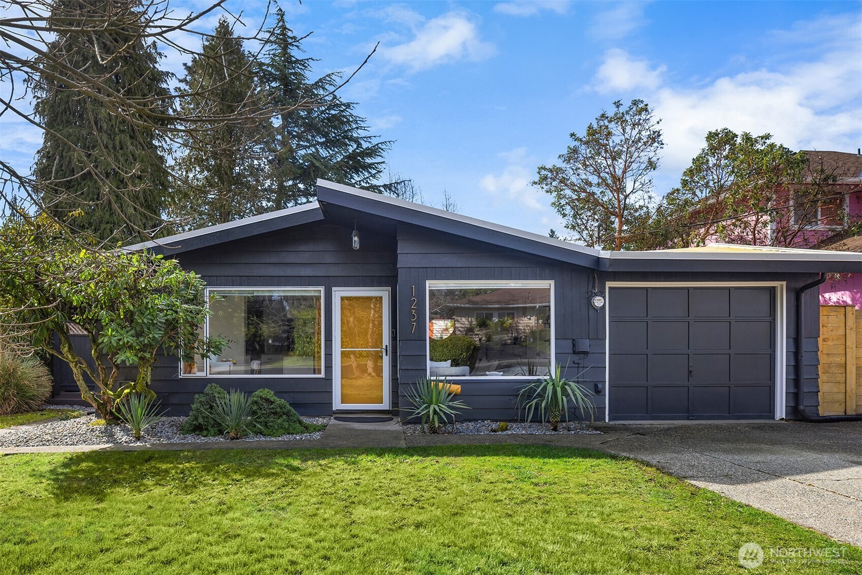 front view of a house with a yard