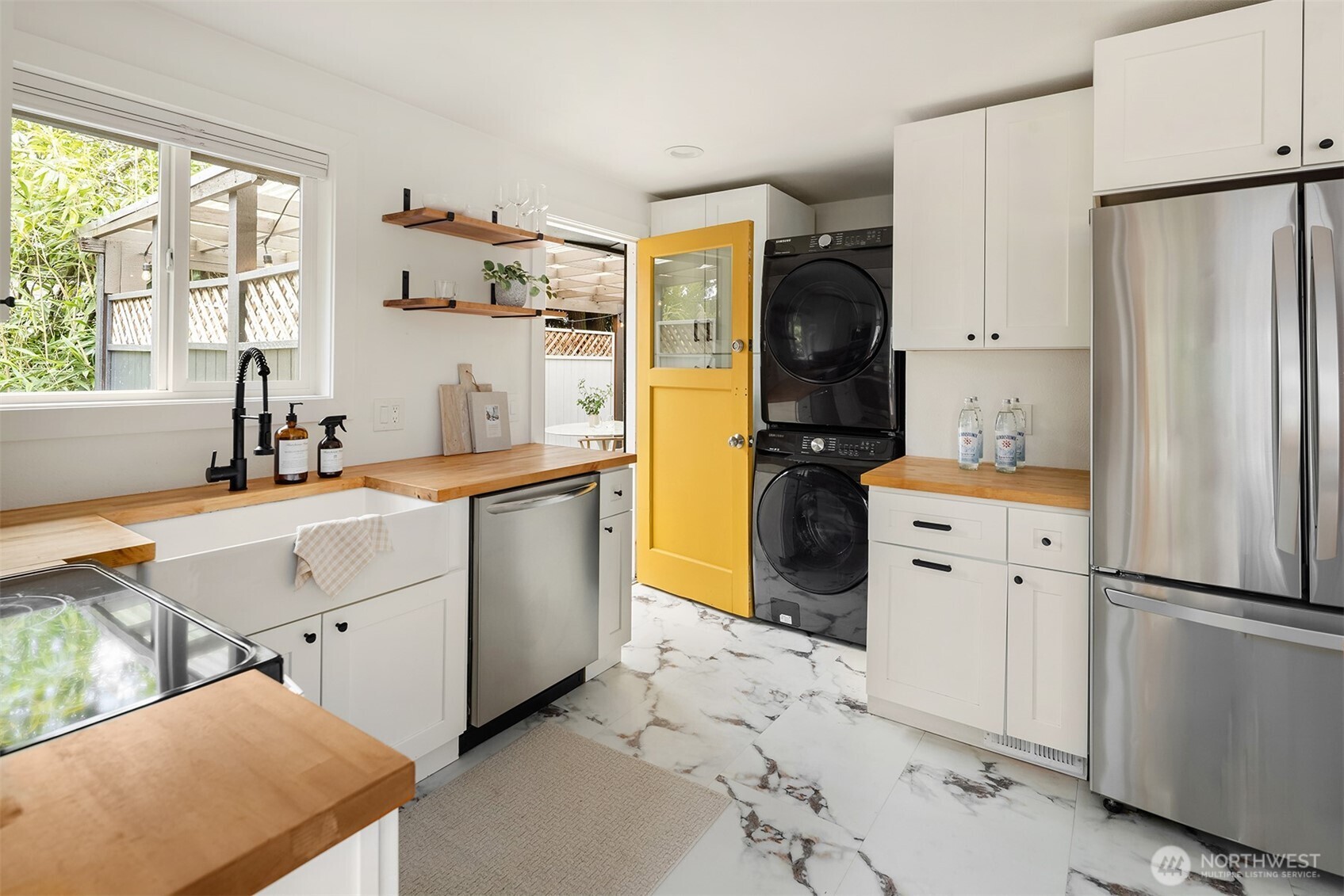 1237 Southwest 118th Street Burien, WA 98146 - Photo 14 of 27 a kitchen with white cabinets and refrigerator