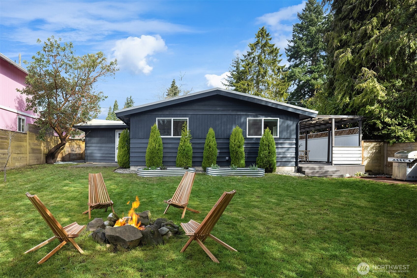 1237 Southwest 118th Street Burien, WA 98146 - Photo 22 of 27 a view of a house with a yard and sitting area