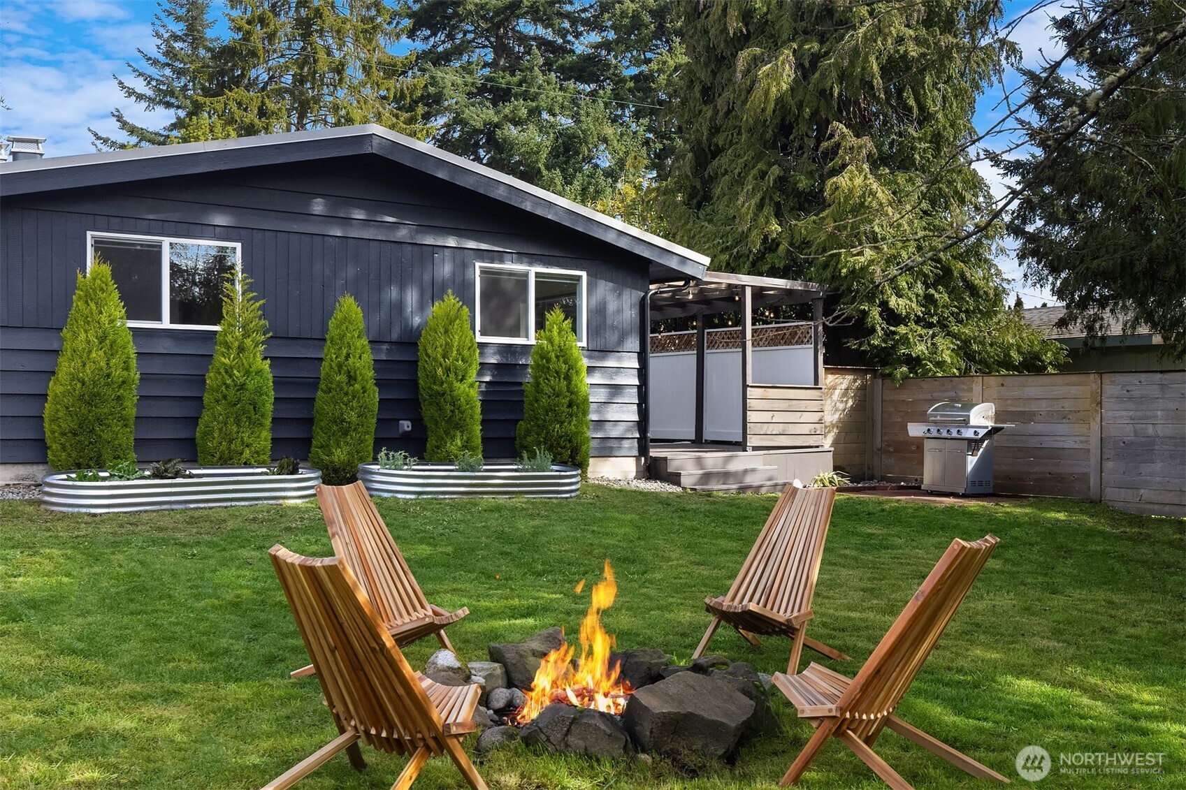 1237 Southwest 118th Street Burien, WA 98146 - Photo 25 of 27 a view of a chair and table in backyard of the house