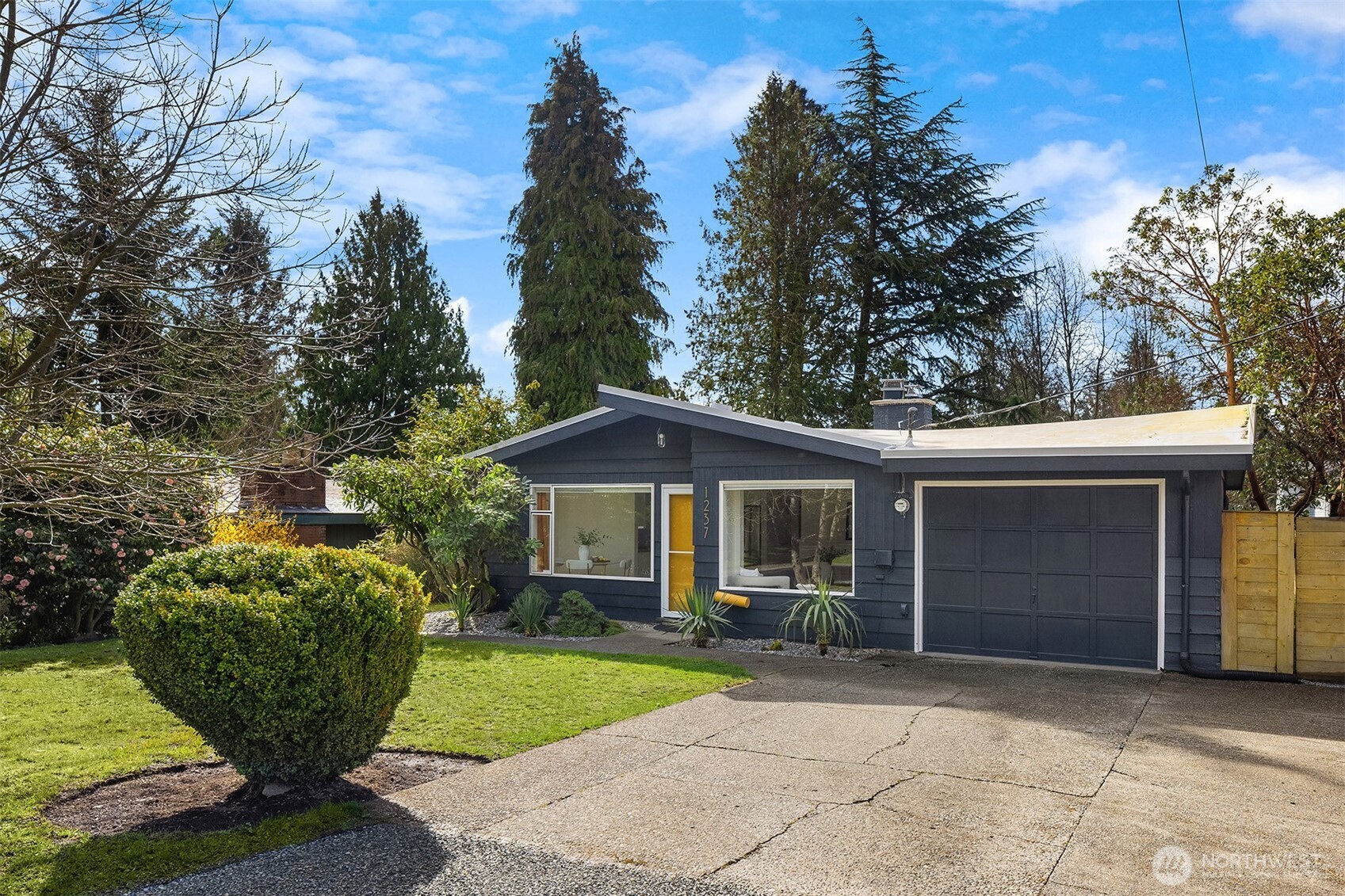 1237 Southwest 118th Street Burien, WA 98146 - Photo 27 of 27 a view of a wooden house with a yard and large trees