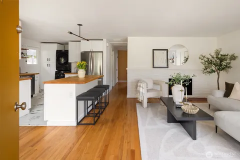 a living room with furniture and a table