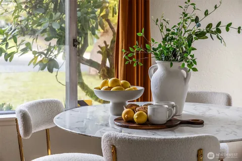 a view of a vase of flowers sitting on a table