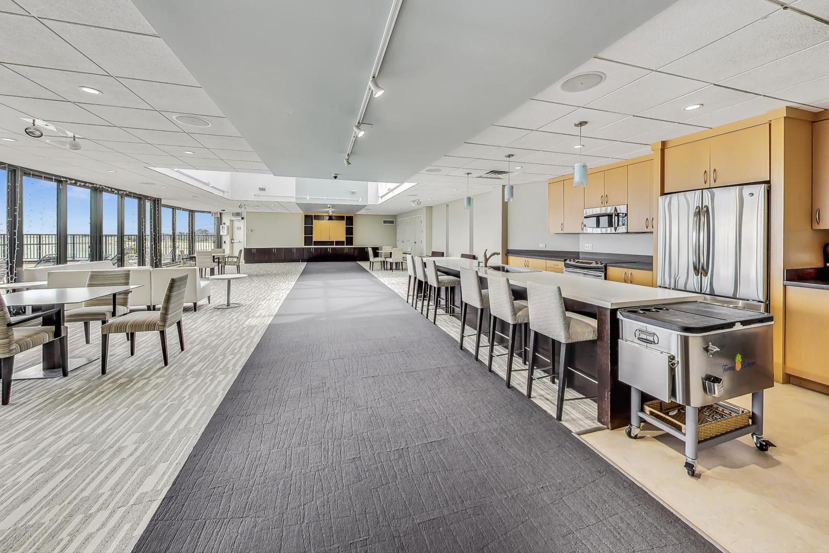 6007 North Sheridan Road, Unit 12B Chicago, IL 60660 - Photo 31 of 38 a large space with lots of furniture and lots of wooden furniture