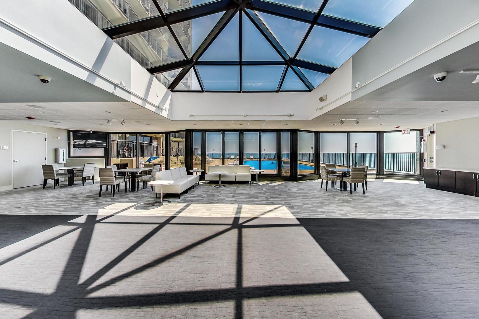 6007 North Sheridan Road, Unit 12B Chicago, IL 60660 - Photo 33 of 38 a living room with lots of furniture and a table