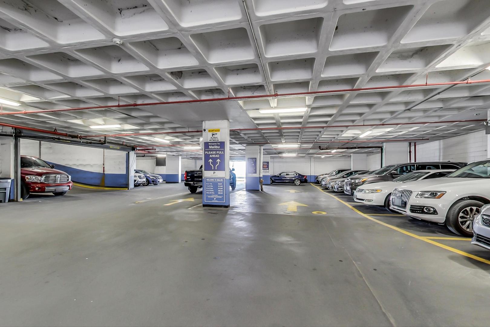 6007 North Sheridan Road, Unit 12B Chicago, IL 60660 - Photo 37 of 38 a view of parking garage with cars