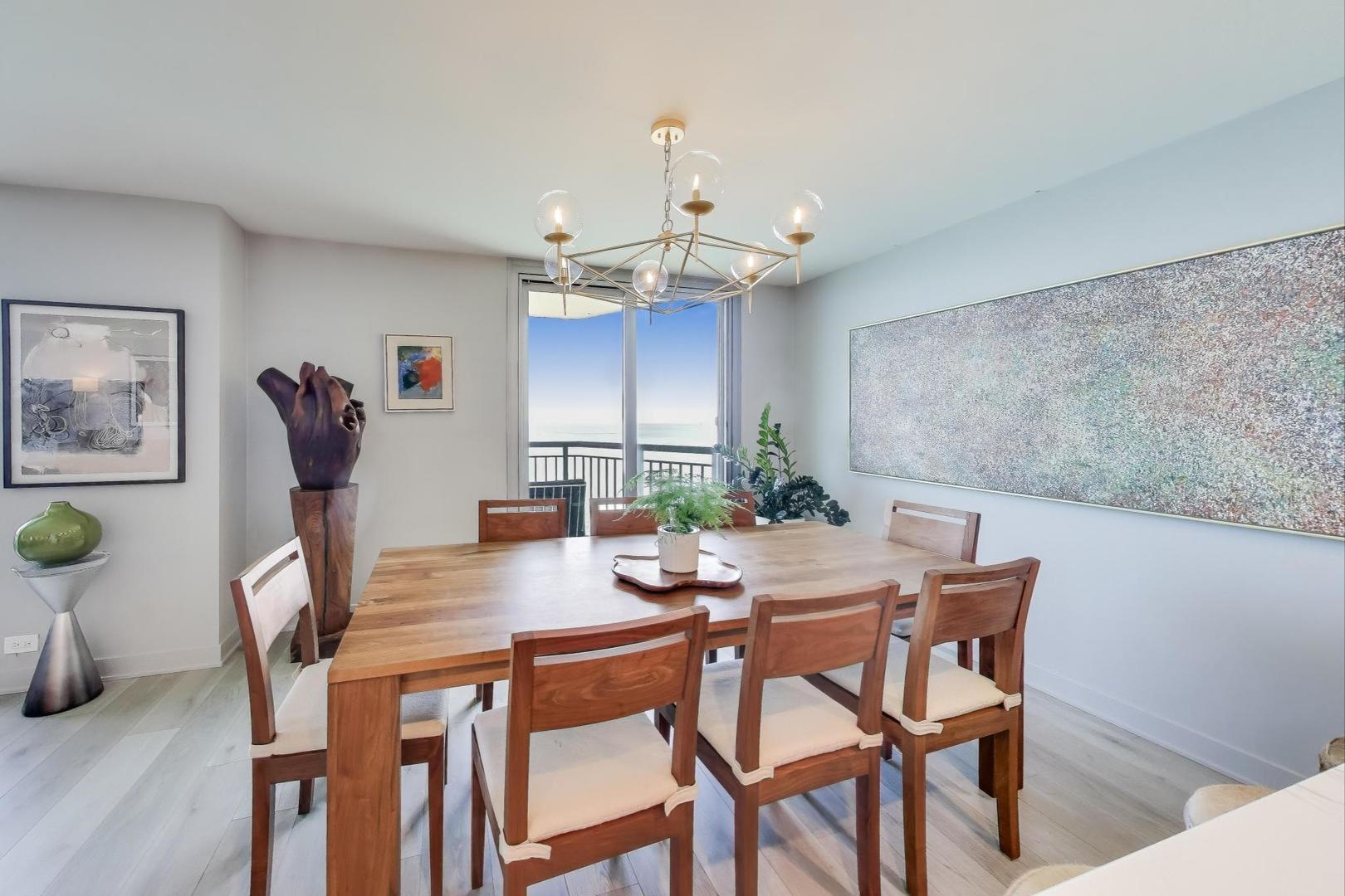 6007 North Sheridan Road, Unit 12B Chicago, IL 60660 - Photo 9 of 38 a view of a dining room with furniture