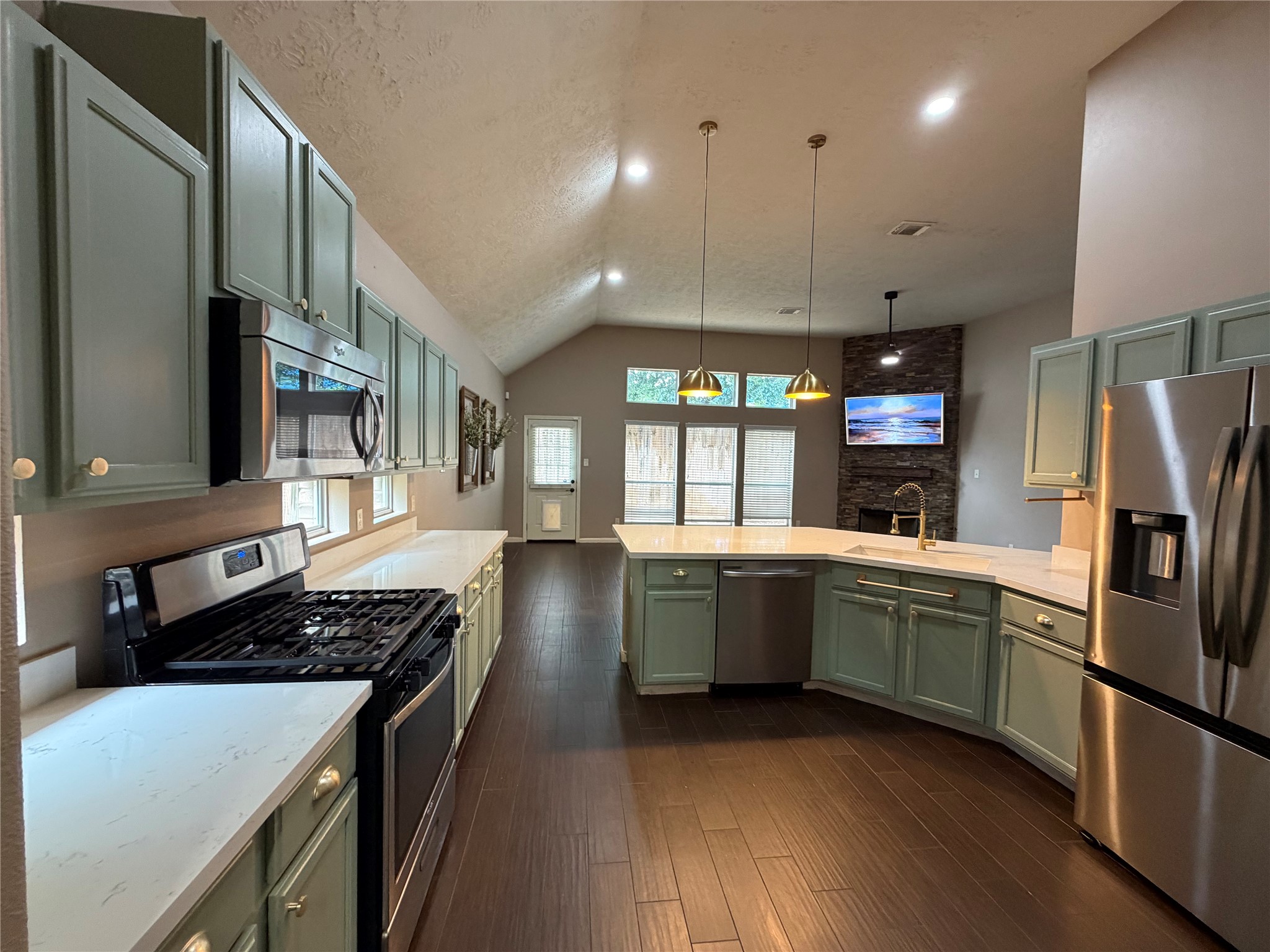 903 Cascade Ridge Katy, TX 77494 - Photo 7 of 24 a kitchen with stainless steel appliances granite countertop a stove and a refrigerator