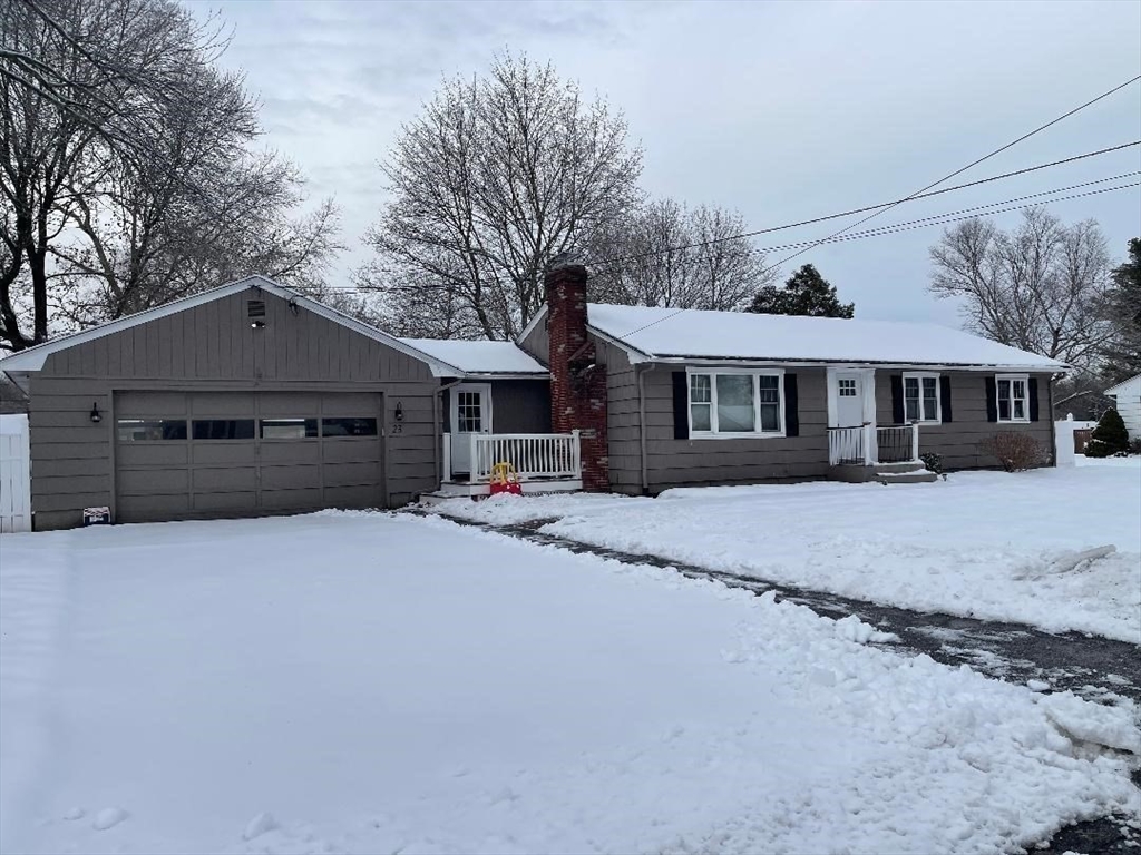 23 Western Avenue West Boylston, MA 01583 - Photo 18 of 18 a front view of a house with a yard and garage