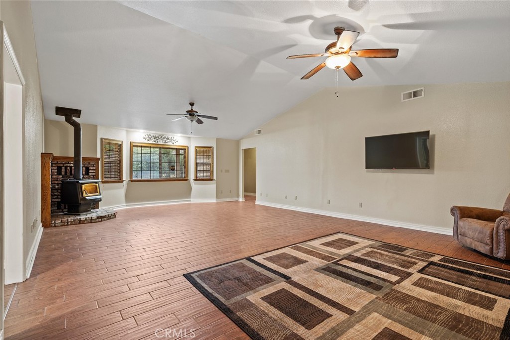 24235 Moon Corning, CA 96021 - Photo 14 of 58 a view of workspace with wooden floor and ceiling fan