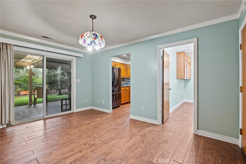 24235 Moon Corning, CA 96021 - Photo 15 of 58 a view of an empty room with wooden floor and a window