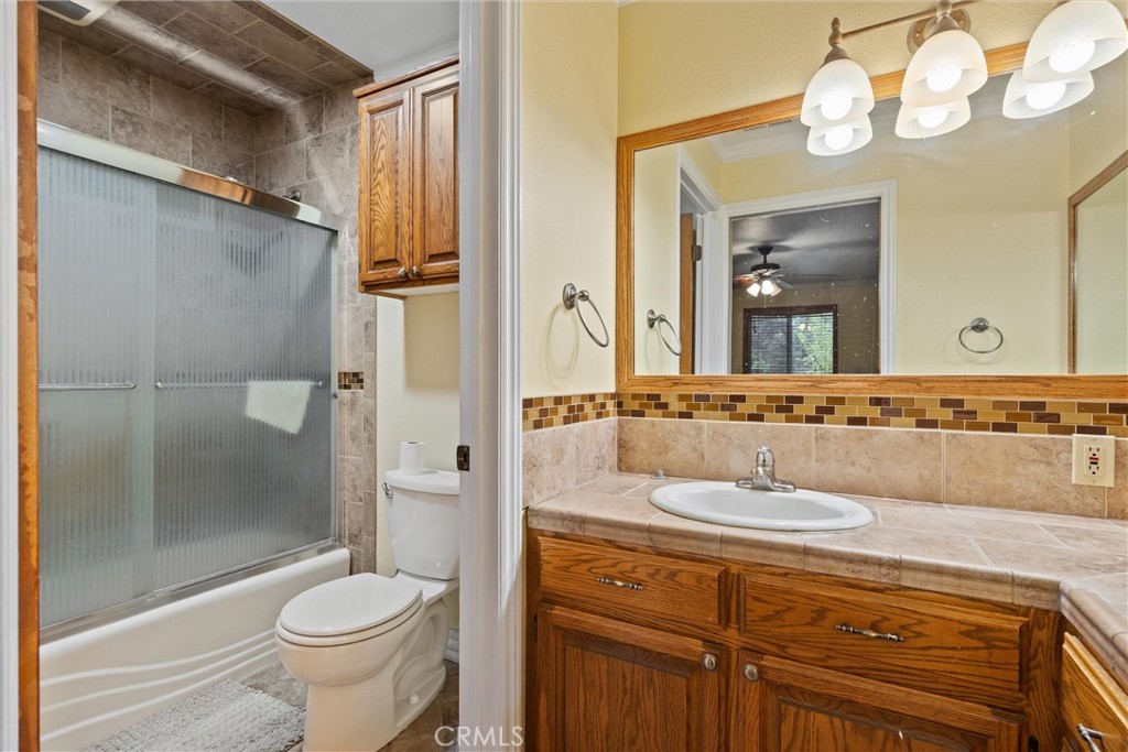 24235 Moon Corning, CA 96021 - Photo 24 of 58 a bathroom with a sink a toilet and shower
