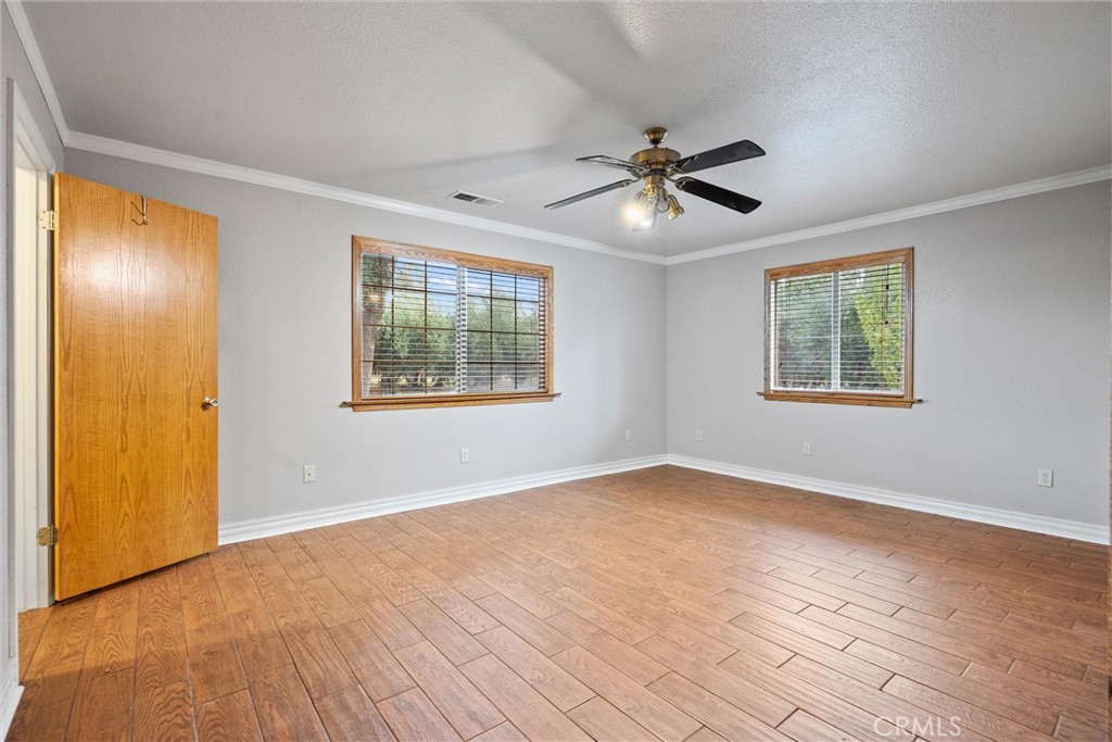 24235 Moon Corning, CA 96021 - Photo 29 of 58 wooden floor in an empty room with a window