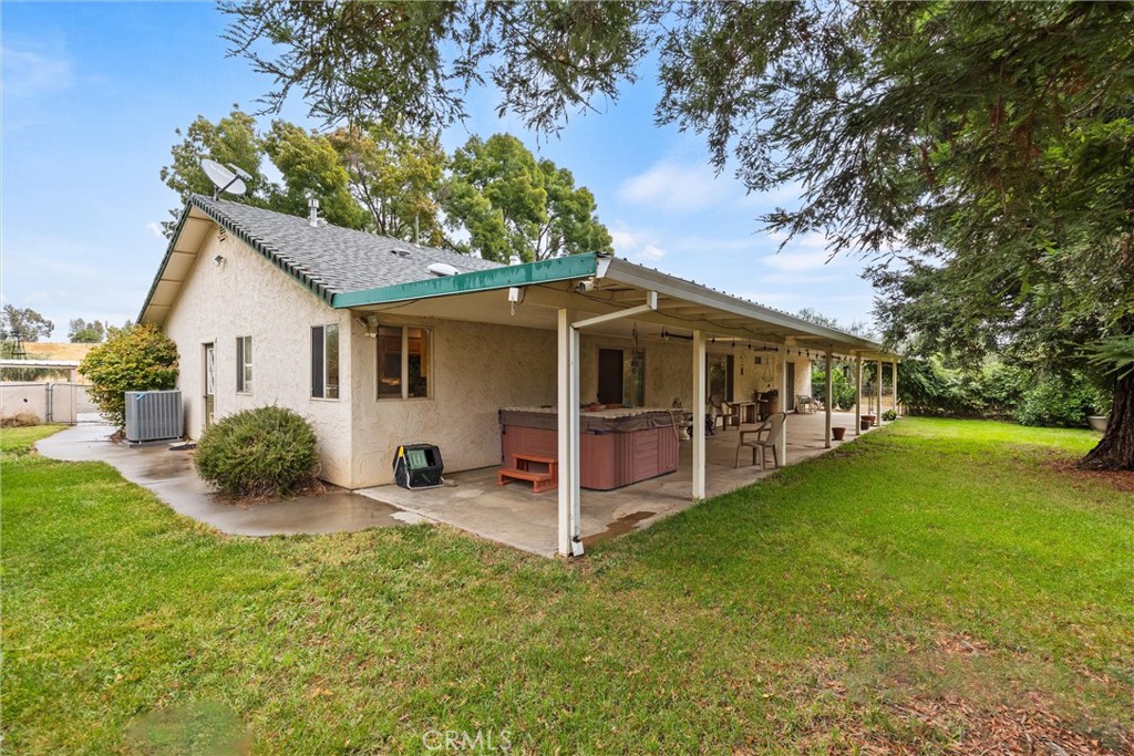 24235 Moon Corning, CA 96021 - Photo 33 of 58 a view of a house with backyard porch and garden