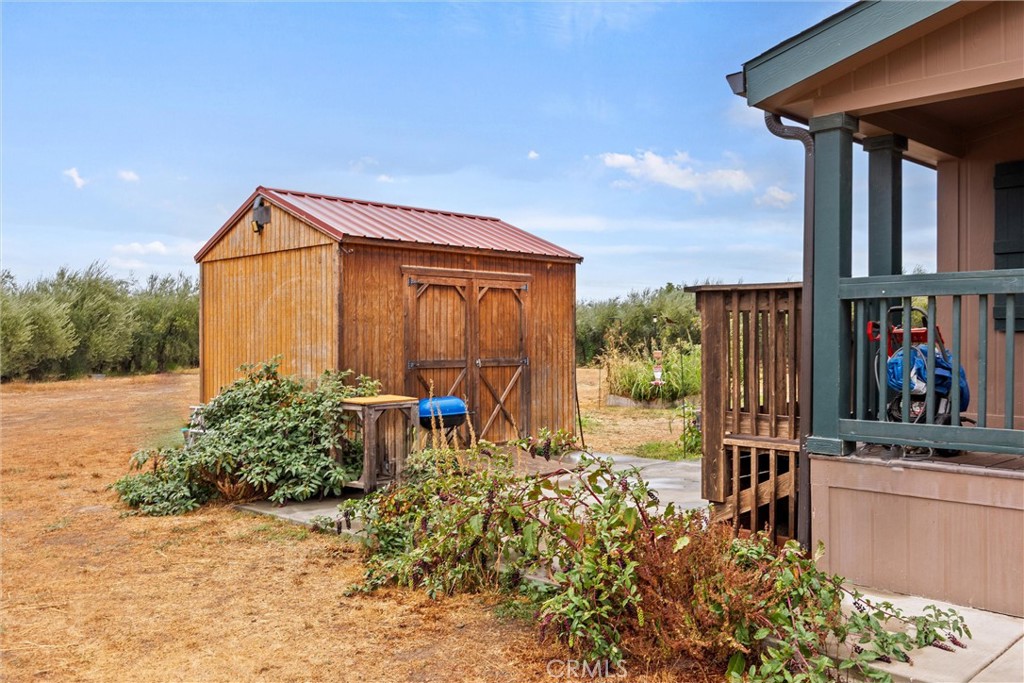 24235 Moon Corning, CA 96021 - Photo 40 of 58 a backyard of a house with yard and outdoor seating