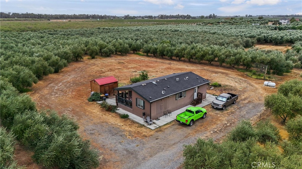 24235 Moon Corning, CA 96021 - Photo 45 of 58 an aerial view of a house with a garden and lake view