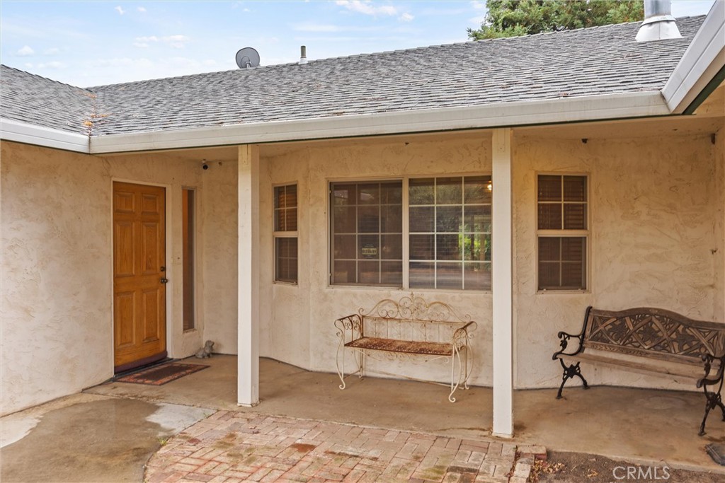 24235 Moon Corning, CA 96021 - Photo 9 of 58 a front view of a house with a large window