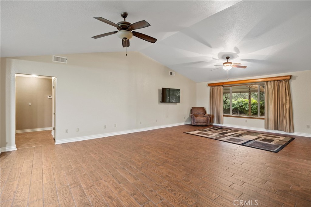 24235 Moon Corning, CA 96021 - Photo 10 of 58 a view of empty room with wooden floor and fan
