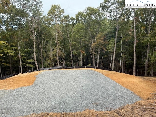 Peck Peak Road Jefferson, NC 28640 - Photo 15 of 22 a view of a backyard with large trees