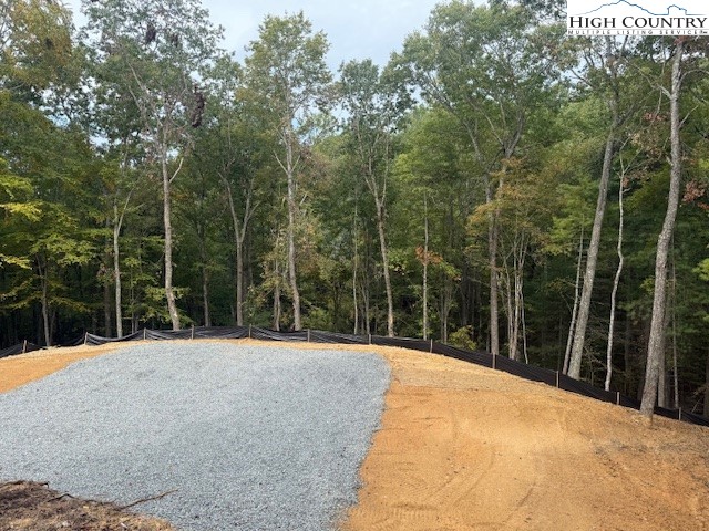 Peck Peak Road Jefferson, NC 28640 - Photo 17 of 22 a backyard of a house with a wooden fence