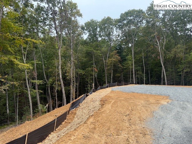 Peck Peak Road Jefferson, NC 28640 - Photo 8 of 22 a view of a backyard with a large tree