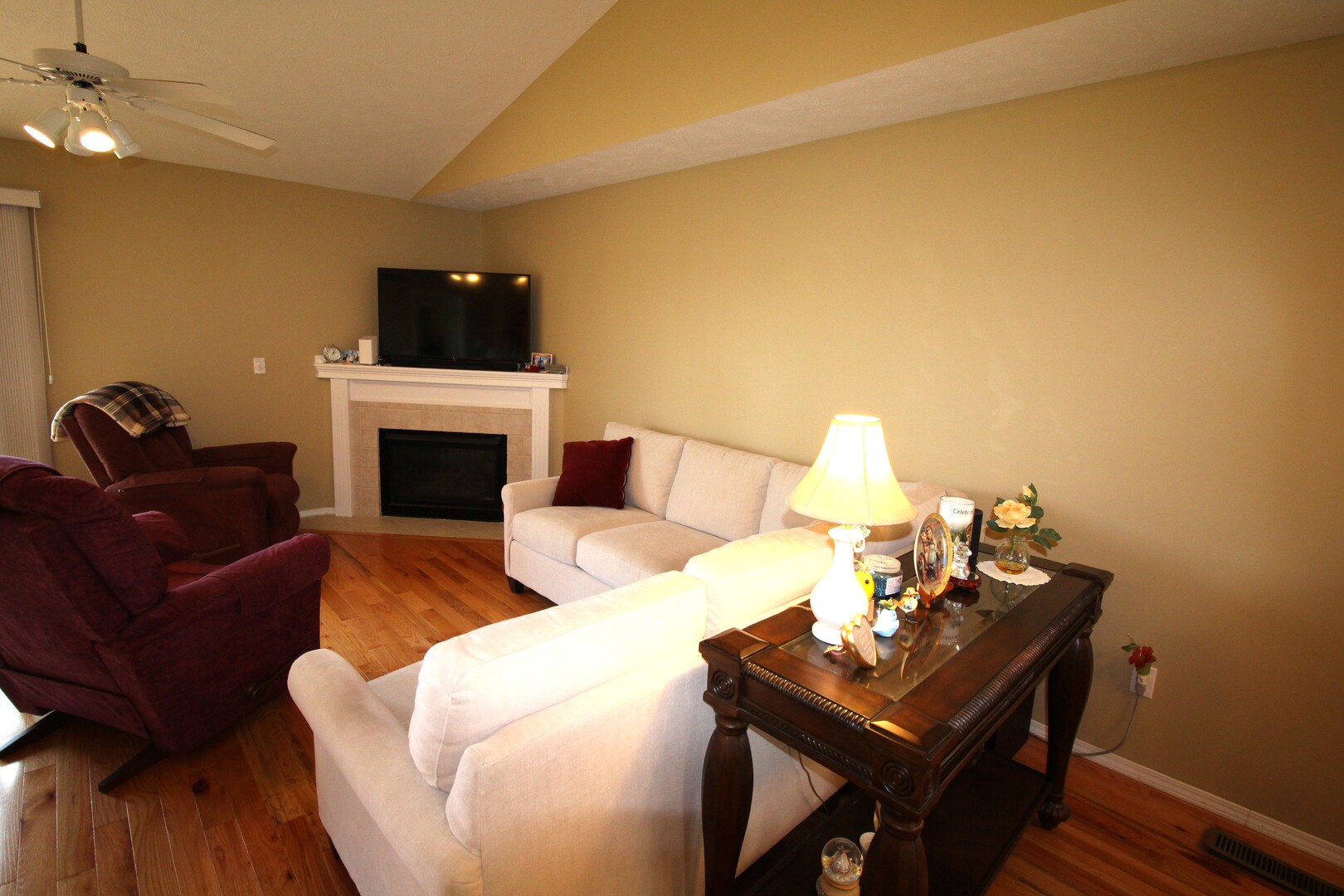25 Oak Park Road Bloomington, IL 61701 - Photo 7 of 28 a living room with furniture and a fireplace