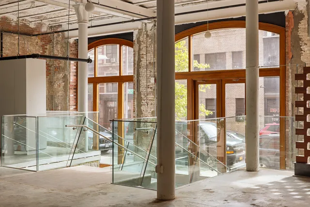 a porch with a glass door and glass door