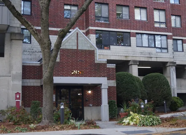 a front view of a building with garden