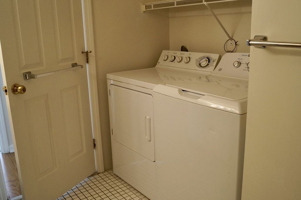 200 Ledgewood Drive, Unit 205 Stoneham, MA 02180 - Photo 11 of 18 a utility room with dryer and washer