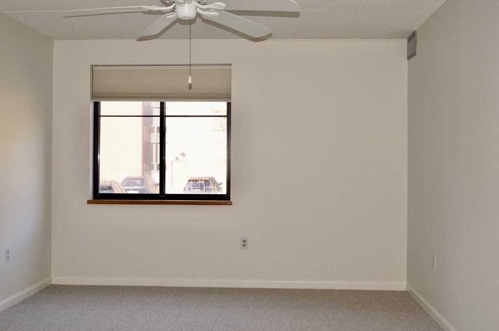 200 Ledgewood Drive, Unit 205 Stoneham, MA 02180 - Photo 13 of 18 a view of a window in a room
