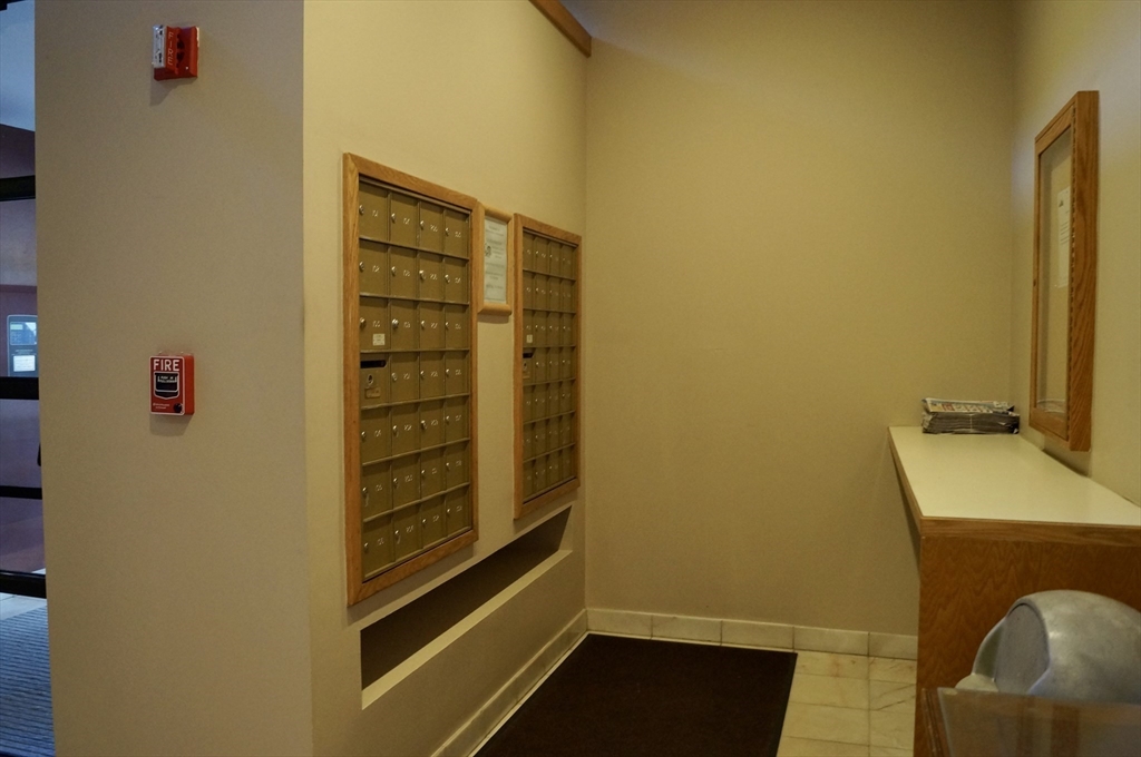 200 Ledgewood Drive, Unit 205 Stoneham, MA 02180 - Photo 18 of 18 a bathroom with a sink and a mirror