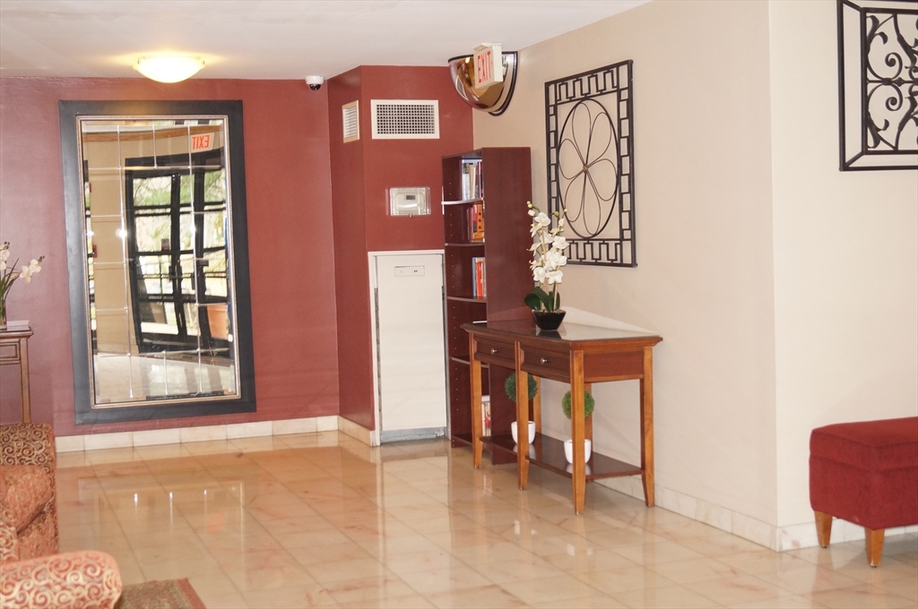 200 Ledgewood Drive, Unit 205 Stoneham, MA 02180 - Photo 3 of 18 a view of livingroom with furniture and workspace