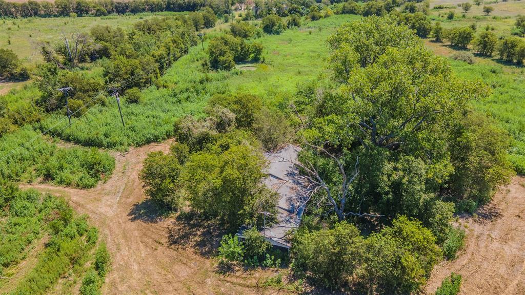 0 Interstate 35 Eddy, TX 76524 - Photo 10 of 18 an aerial view of residential house with outdoor space and trees all around