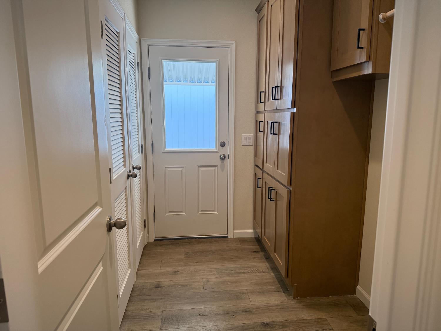 Undisclosed Address Medford, OR 97501 - Photo 12 of 23 a view of a hallway with wooden floor and staircase