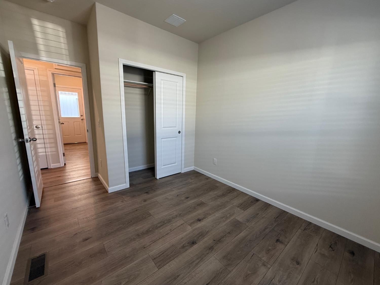 Undisclosed Address Medford, OR 97501 - Photo 15 of 23 an empty room with wooden floor and windows