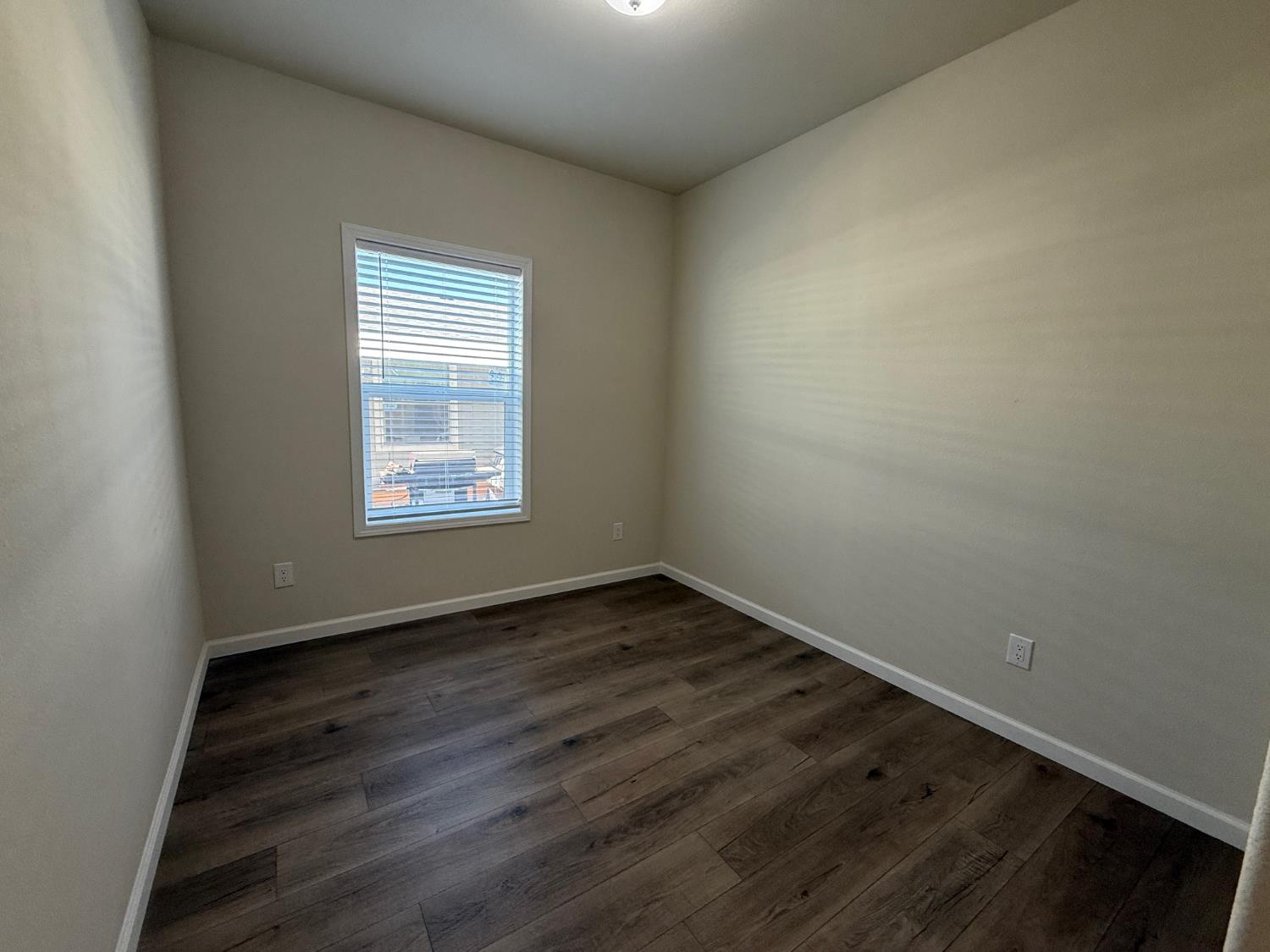Undisclosed Address Medford, OR 97501 - Photo 16 of 23 an empty room with wooden floor and windows