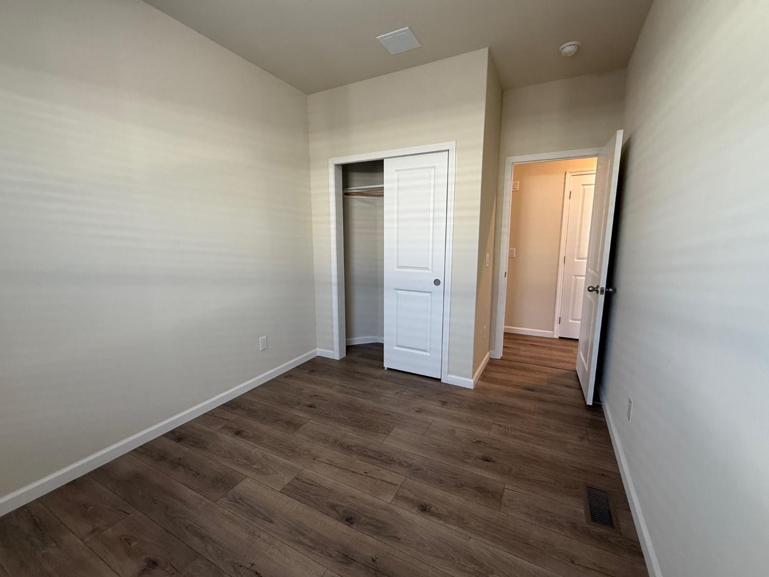 Undisclosed Address Medford, OR 97501 - Photo 17 of 23 an empty room with wooden floor and closet