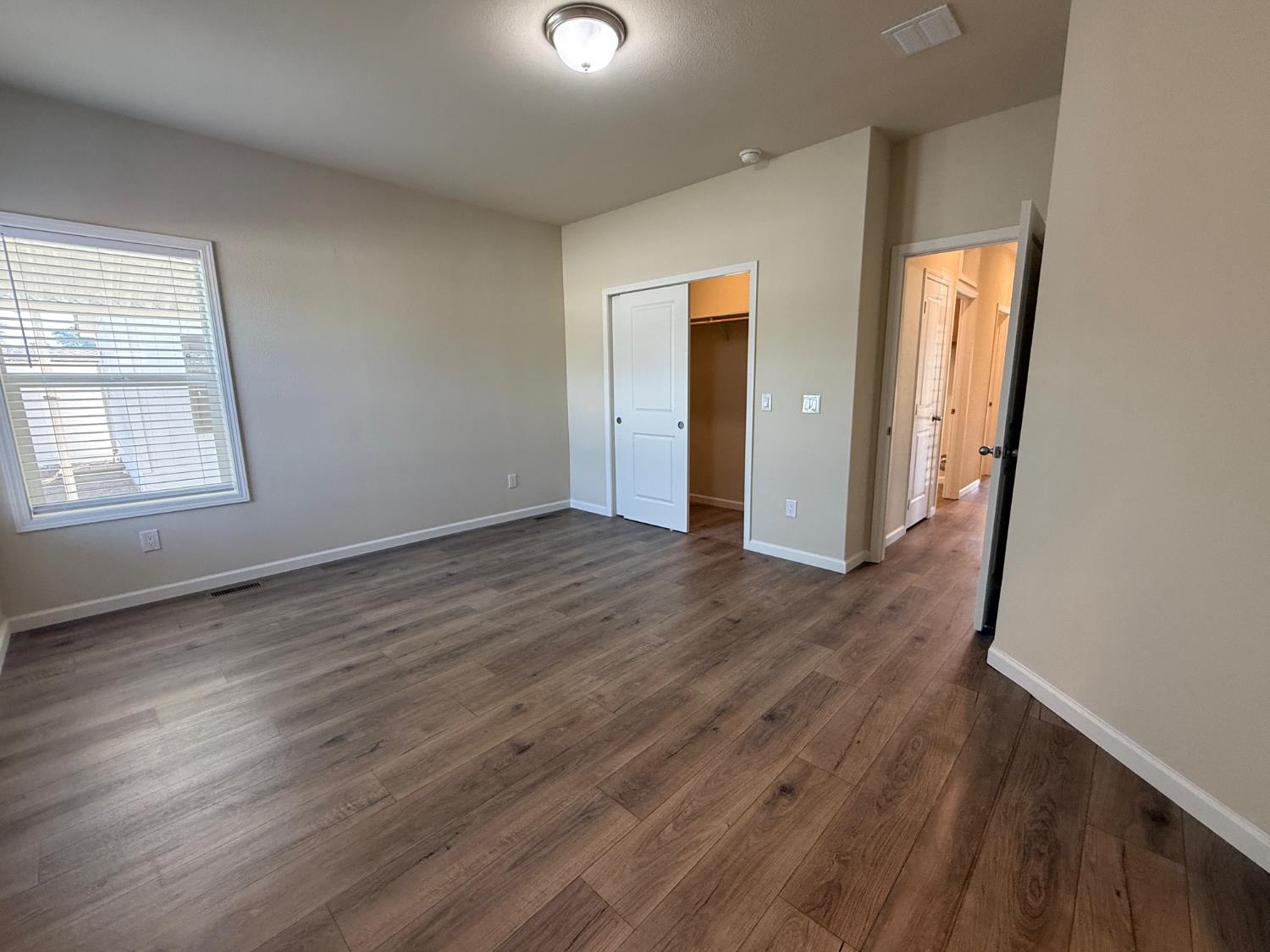 Undisclosed Address Medford, OR 97501 - Photo 20 of 23 an empty room with wooden floor and windows