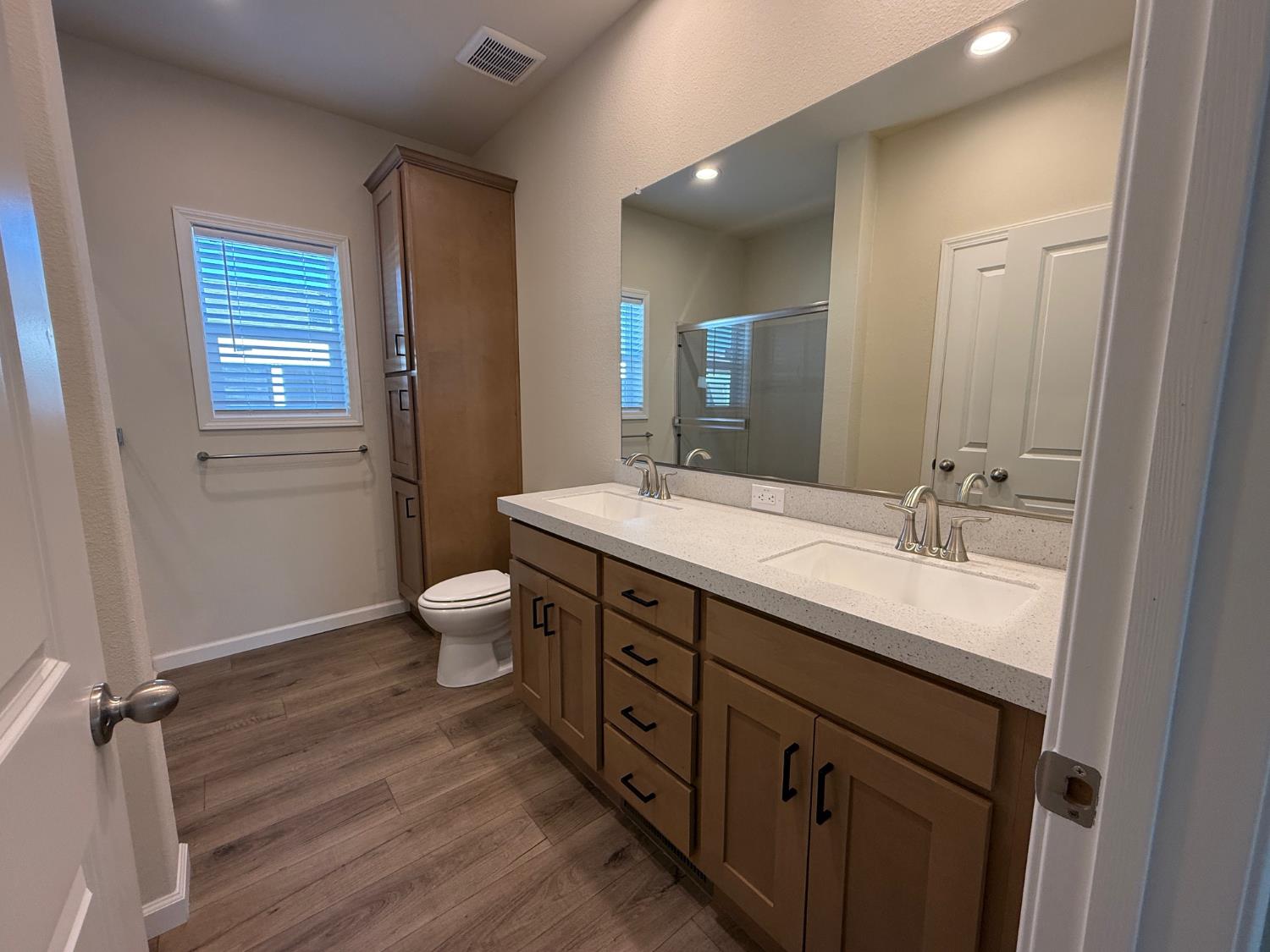 Undisclosed Address Medford, OR 97501 - Photo 22 of 23 a bathroom with a granite countertop sink toilet a large mirror and shower