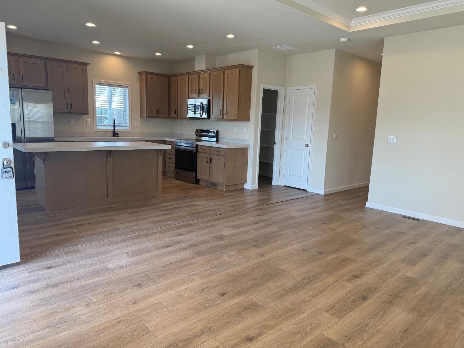Undisclosed Address Medford, OR 97501 - Photo 3 of 23 a kitchen with stainless steel appliances granite countertop a refrigerator sink and cabinets
