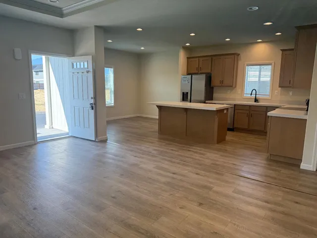 a view of kitchen with cabinets and wooden floor