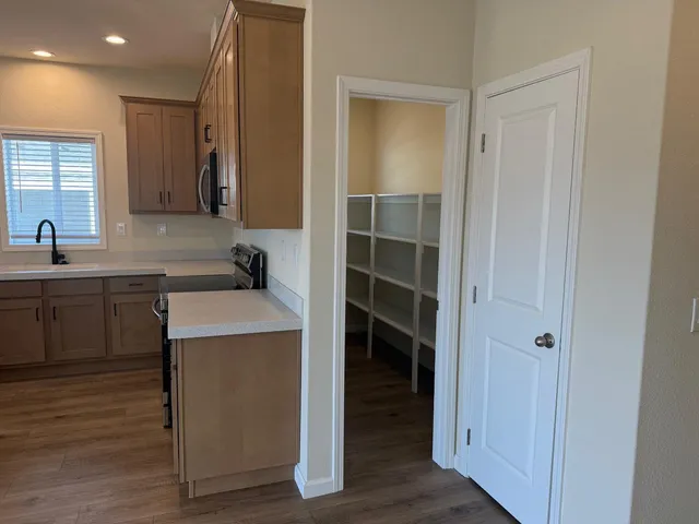 a kitchen with a sink and cabinets