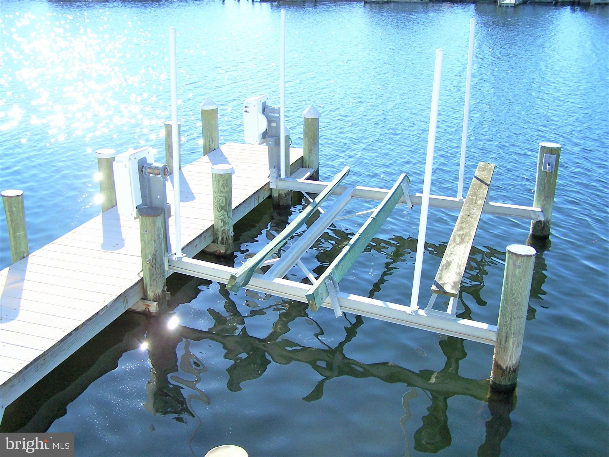 153 Pine Tree Road Ocean City, MD 21842 - Photo 12 of 77 Electric Boat Lift