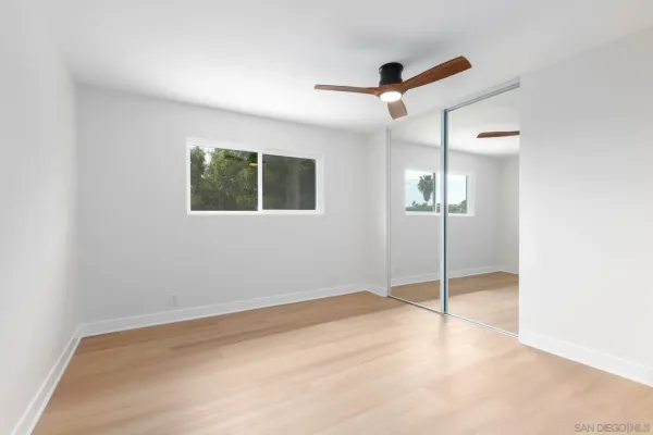 a front view of a house with yard and seating space