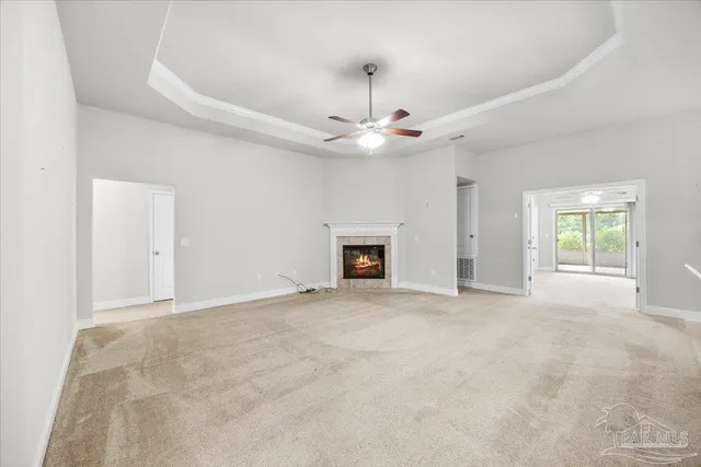 a view of an empty room with a fireplace