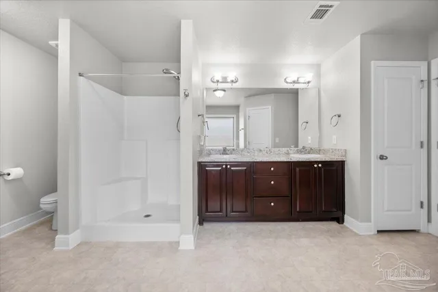 a living room with furniture a table and a large window